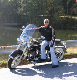 Carla on her motorcycle in the Fall on a beautiful Georgia mountain road.